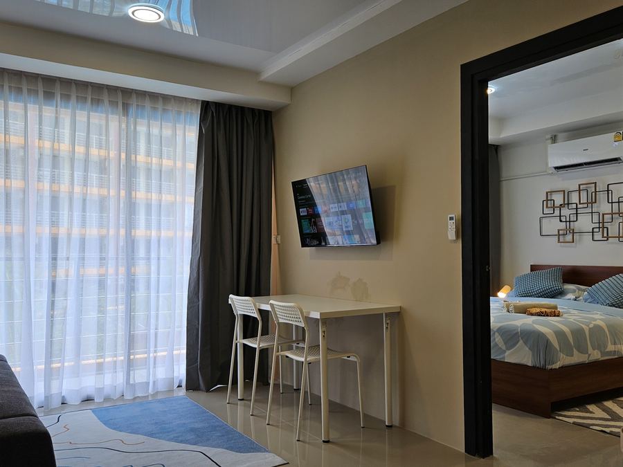 777 Beach Condo: living room and bedroom